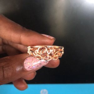 “Love” gold stretch band ring
